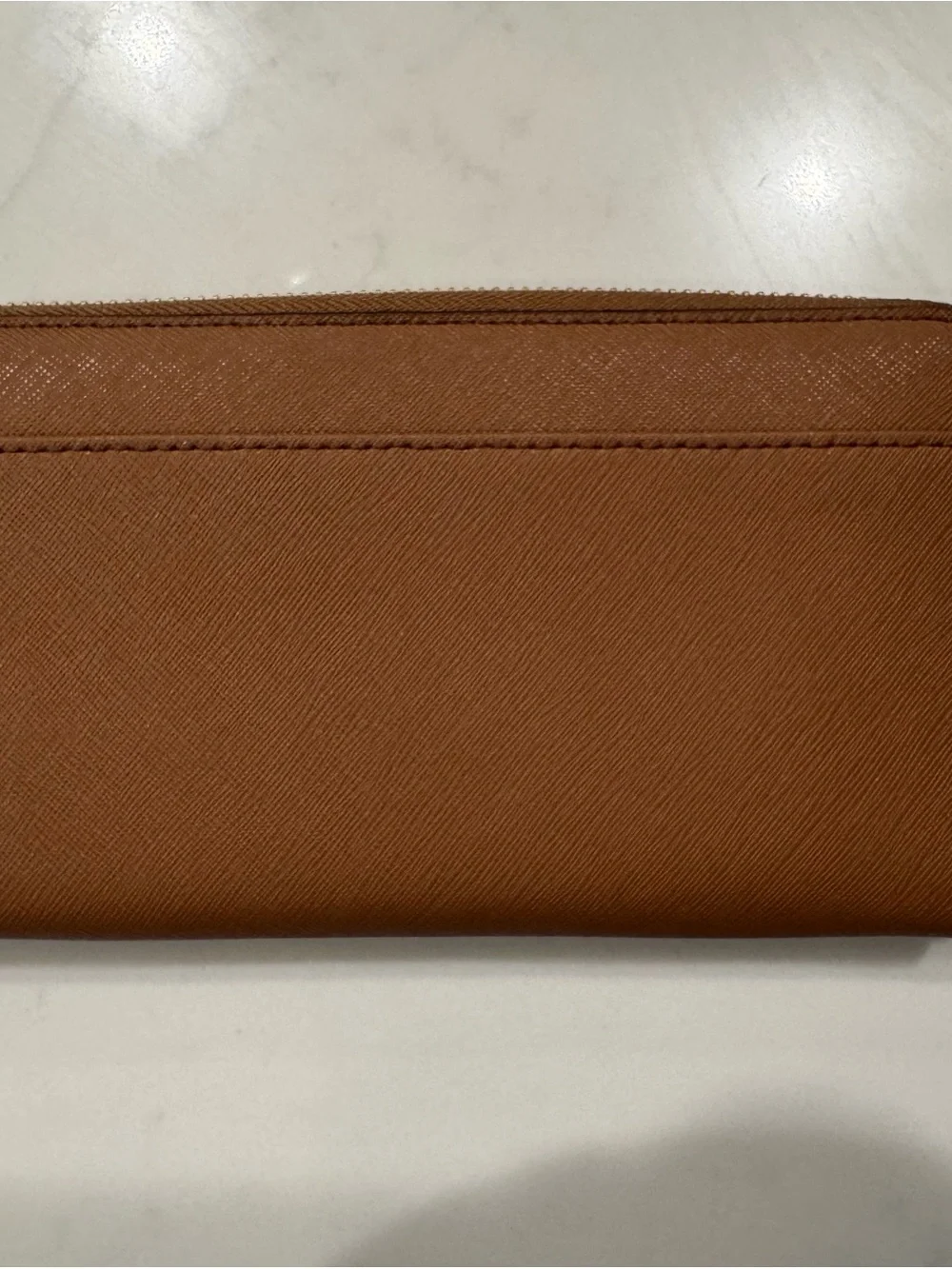 kate spade saffiano zip-around wallet in cognac brown with gold plaque